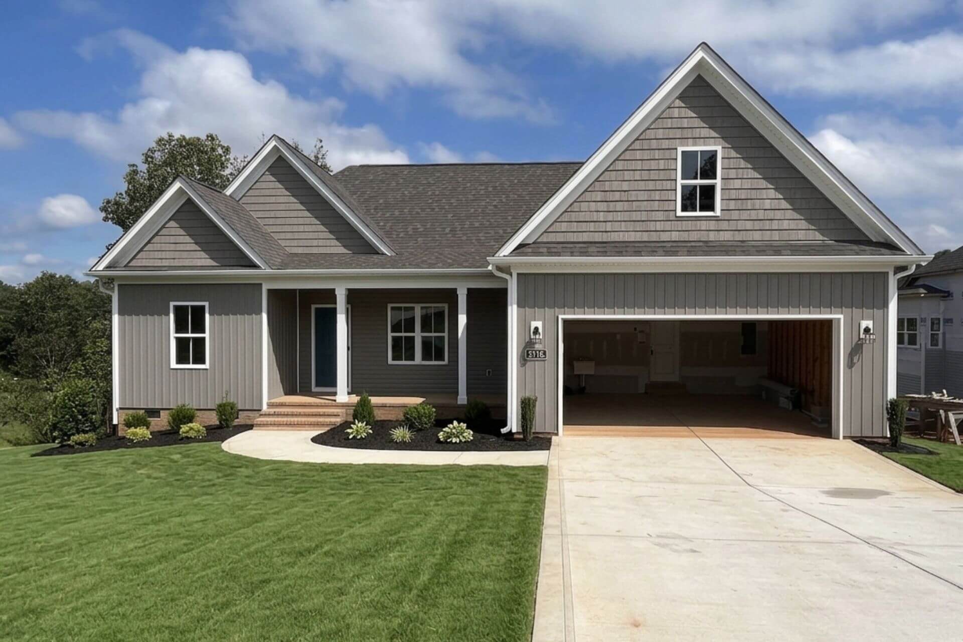 completed mike palmer home with gray trim and siding