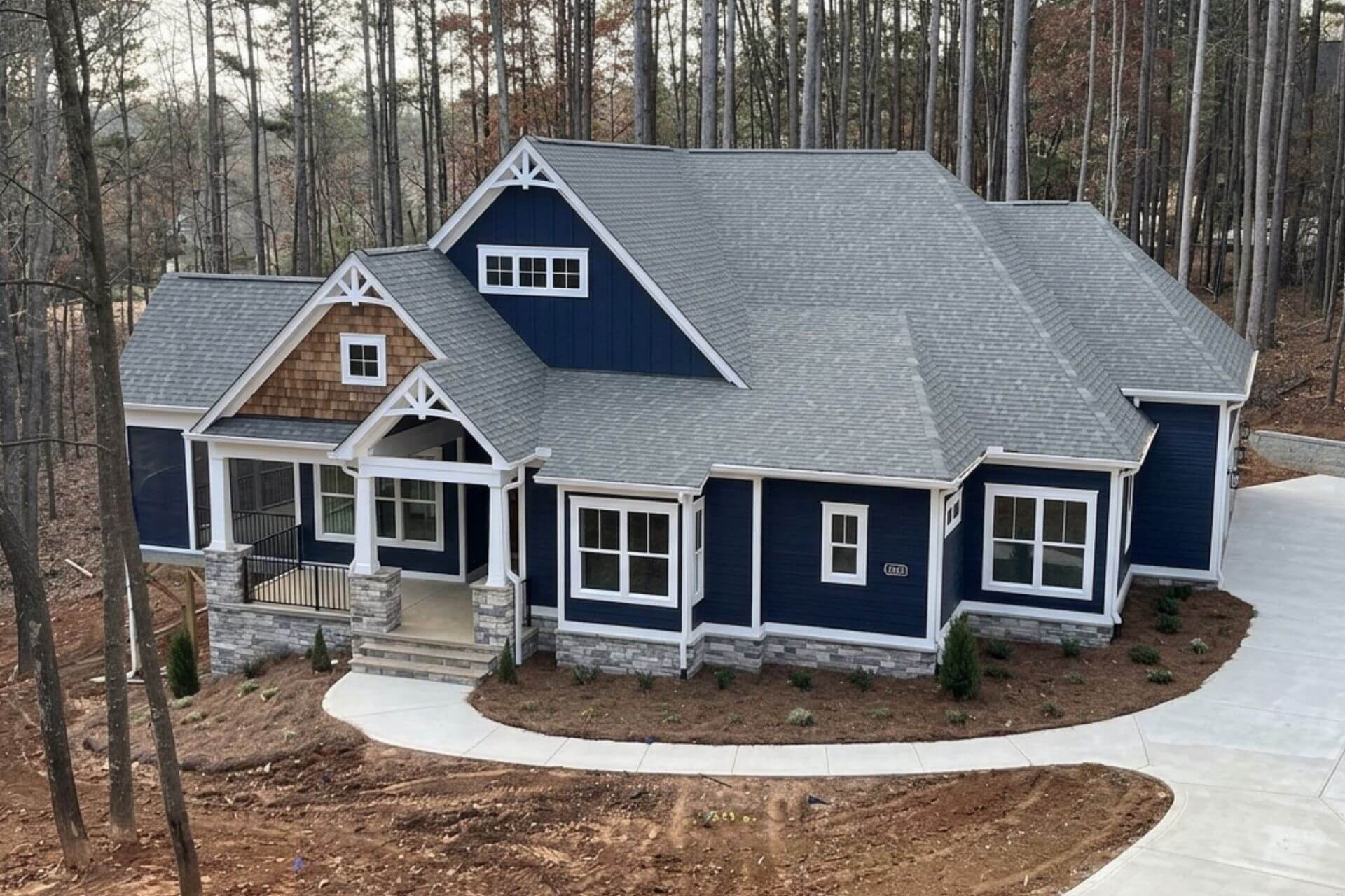 a finished mike palmer home with natural wood and blue siding